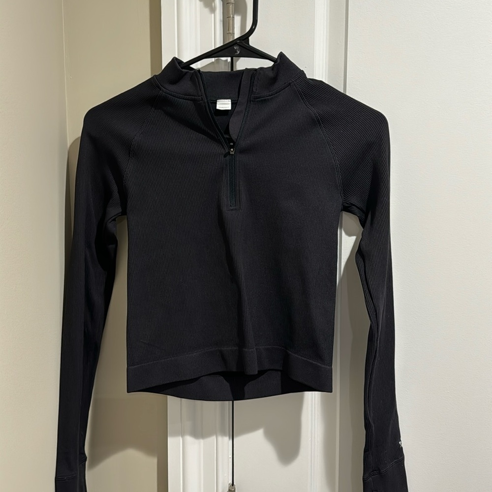 Cropped quarter zip. Black. Tight material, good for working out.